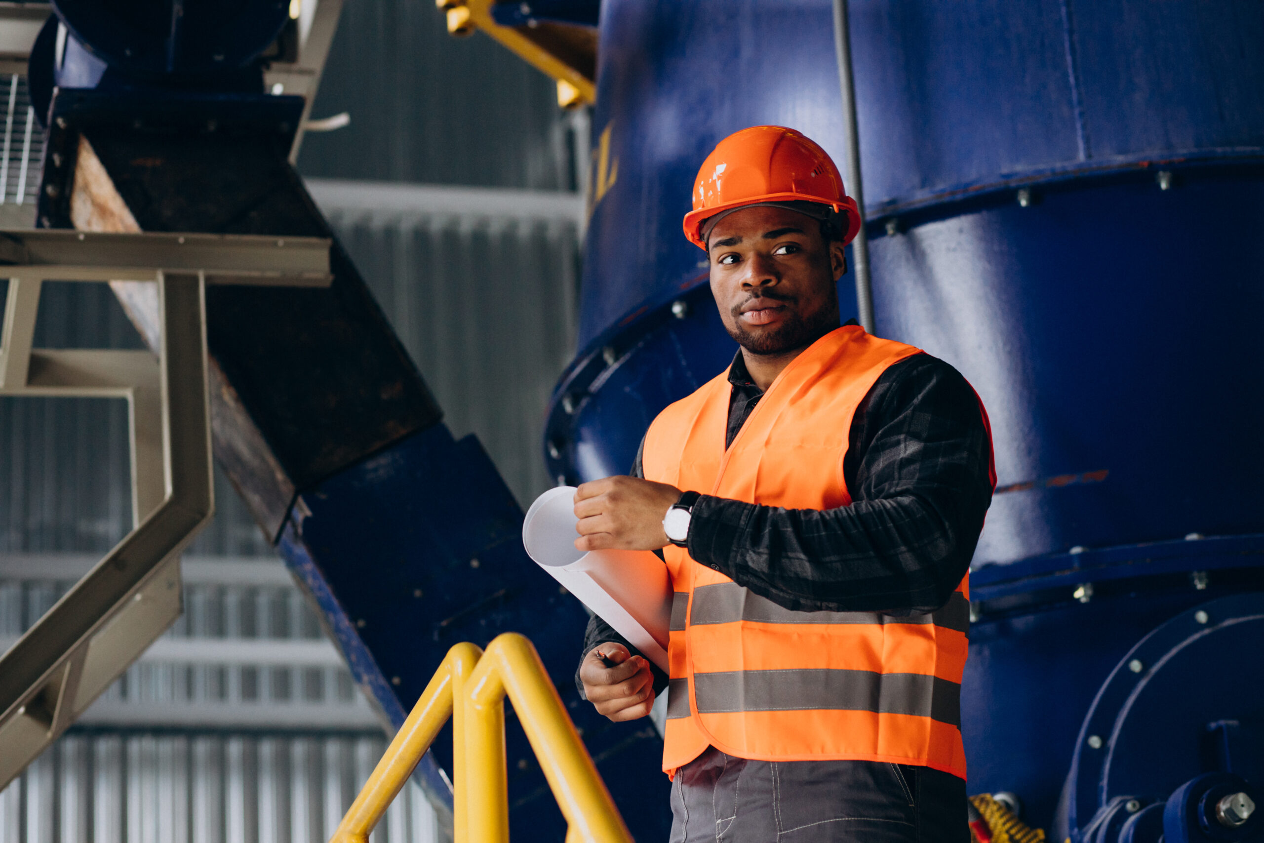 african american worker standing uniform wearing safety hat factory scaled 1
